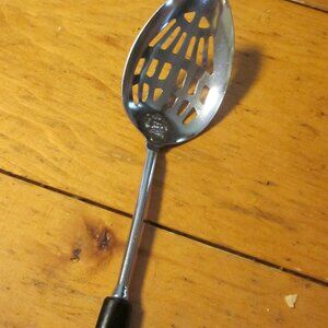 Ecko vtg slotted spoon Chromium 12 in black plastic handle